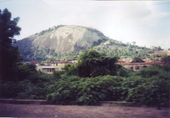 The rocky outcrop of Olosunta Orun'kere rising above the trees near Ikere.