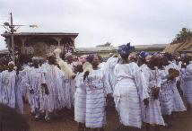 Celebrants dancing within the palace grounds during the annual Yam Festival.