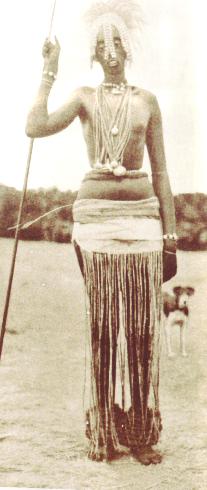 Full-length portrait of Her Royal Highness, the Mwami of Rwanda, in ceremonial dress.