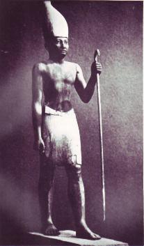 Full-length depiction of a pharaoh of Egypt in crown and ceremonial dress.